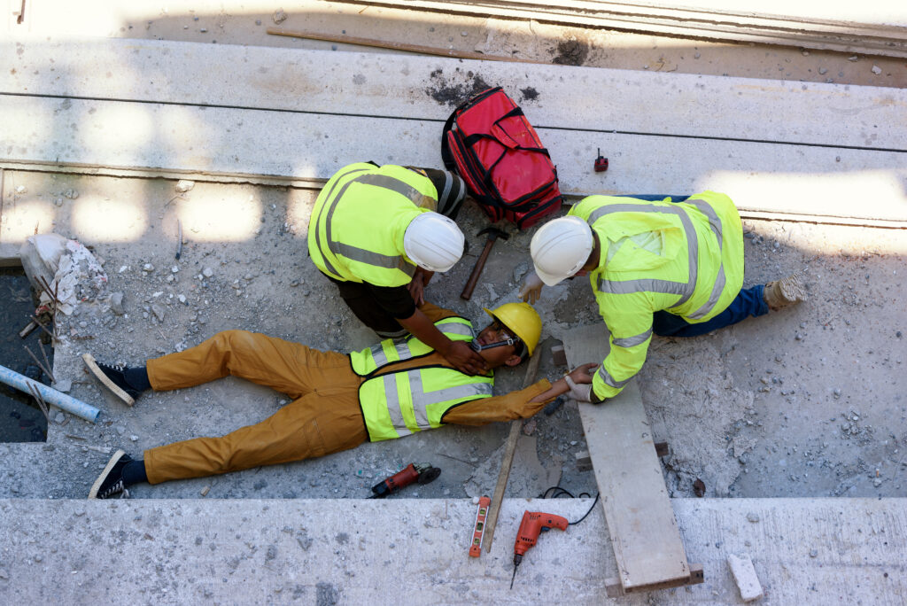 Construction Site Injuries - worker being tended to after fall