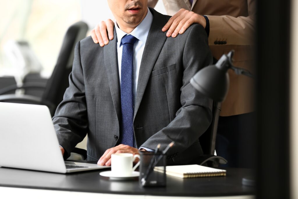 sexual harassment in the workplace - boss touches his employee