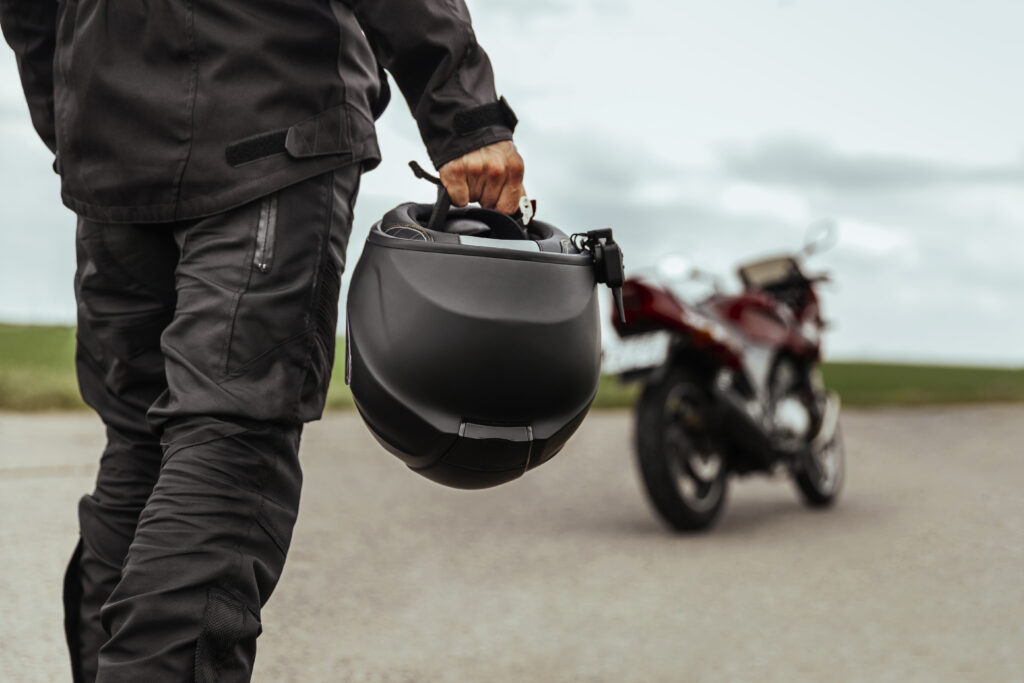 Man holding a motorcycle helmet